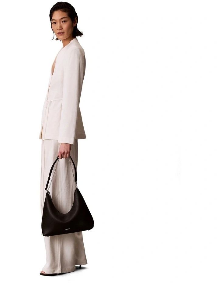 Emblem Hardware Pebble Shoulder Bag in Black image 5