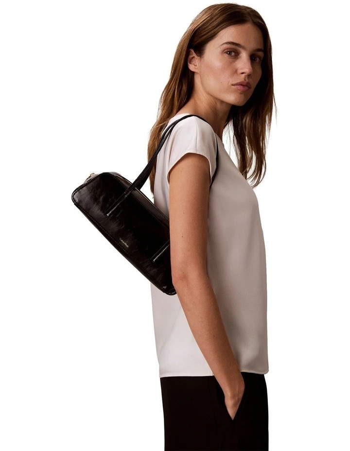 Glossy Embossed Logo Bauletto Shoulder Bag in Black image 5
