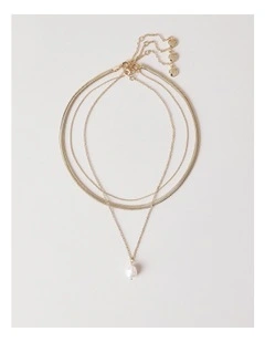 Layered Pearl Necklaces in Gold