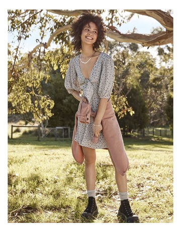 Image of a girl wearing a striped, mid-length dress