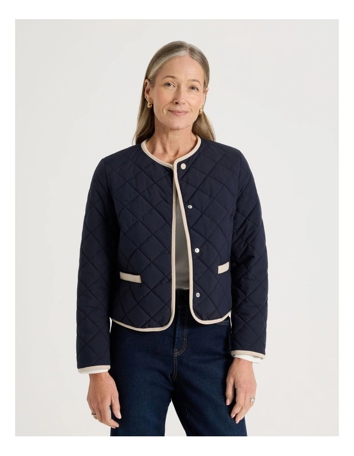 Short Collarless Puffer Jacket With Cord Trim in Navy image 1
