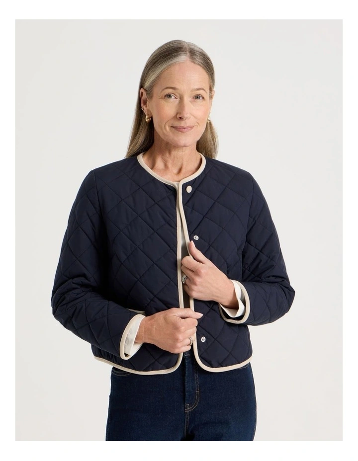 Short Collarless Puffer Jacket With Cord Trim in Navy image 3