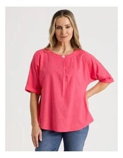 Extended Short Sleeve Top With Front Pleat & Button in Coral