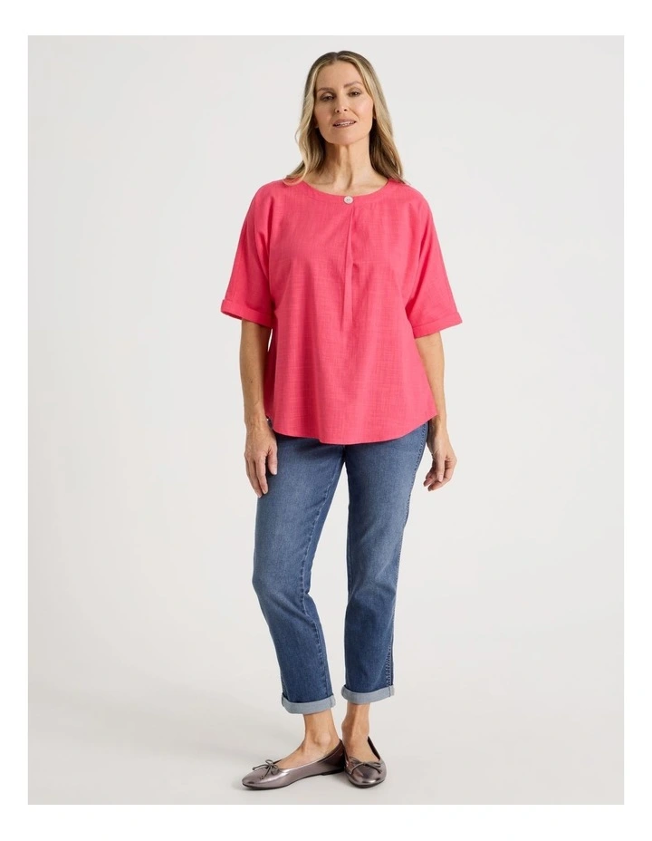 Extended Short Sleeve Top With Front Pleat & Button in Coral image 2