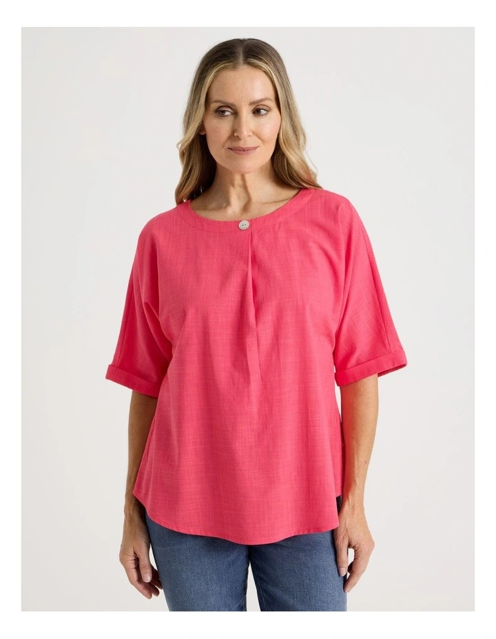 Extended Short Sleeve Top With Front Pleat & Button in Coral image 5