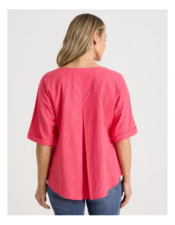 Extended Short Sleeve Top With Front Pleat & Button in Coral image 6