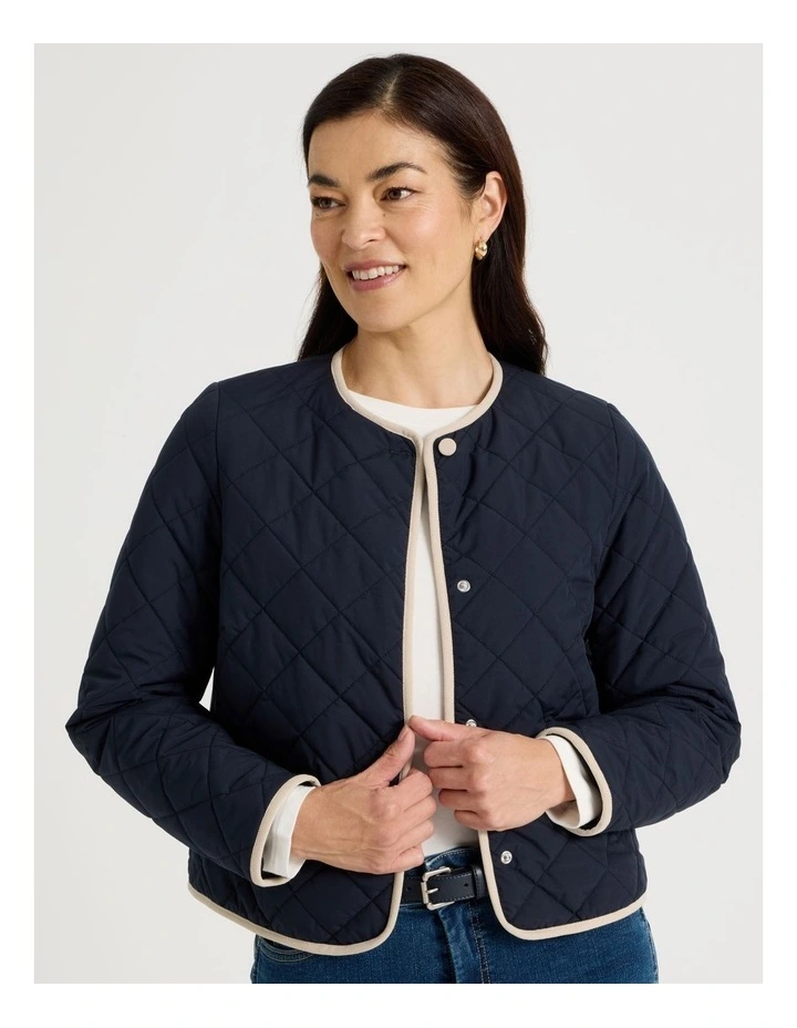 Short Collarless Puffer Jacket With Cord Trim in Navy image 1