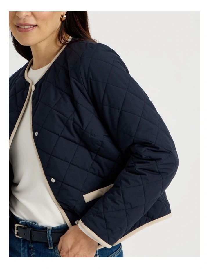 Short Collarless Puffer Jacket With Cord Trim in Navy image 4