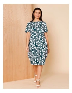 Short Sleeve Knit Dress With Darted Hem And Pockets In Teal/White Abstract Print