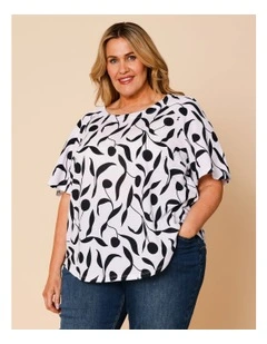 Short Raglan Sleeve Tee With Curved Hem In White With Black Leaf Print