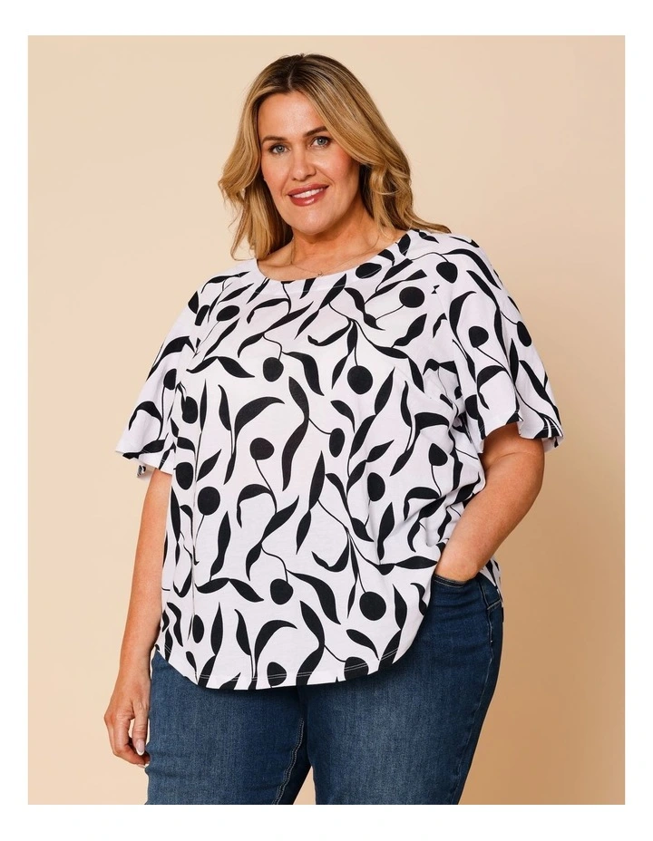 Short Raglan Sleeve Tee With Curved Hem In White With Black Leaf Print image 1