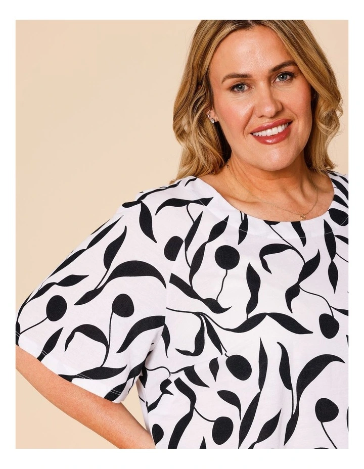 Short Raglan Sleeve Tee With Curved Hem In White With Black Leaf Print image 3