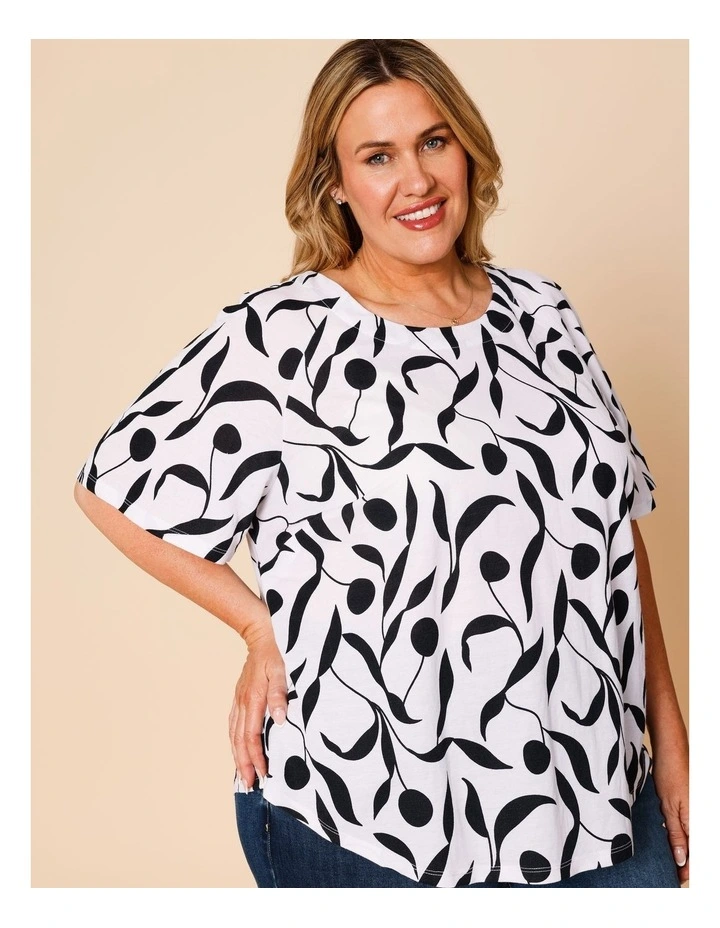 Short Raglan Sleeve Tee With Curved Hem In White With Black Leaf Print image 4