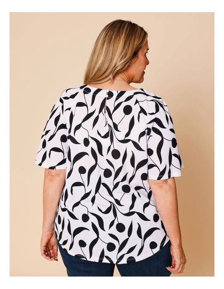 Short Raglan Sleeve Tee With Curved Hem In White With Black Leaf Print image 5