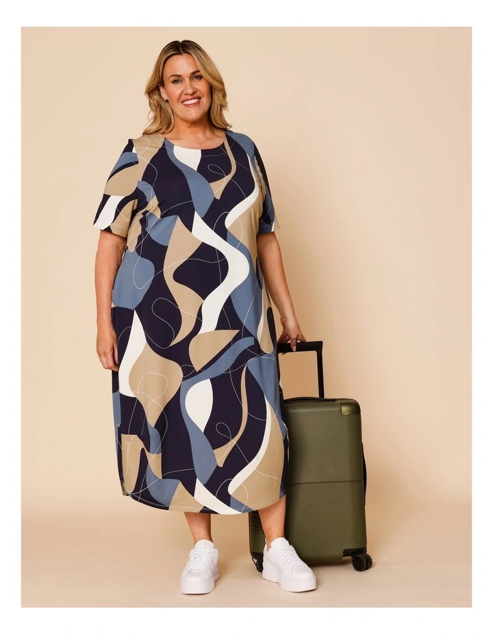 Short Sleeve Knit Dress With Darted Hem And Pockets In Blues Print image 1