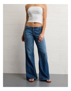 Dreamy Drape Stretch Super Low-Rise Baggy Flare Jeans in Medium Wash
