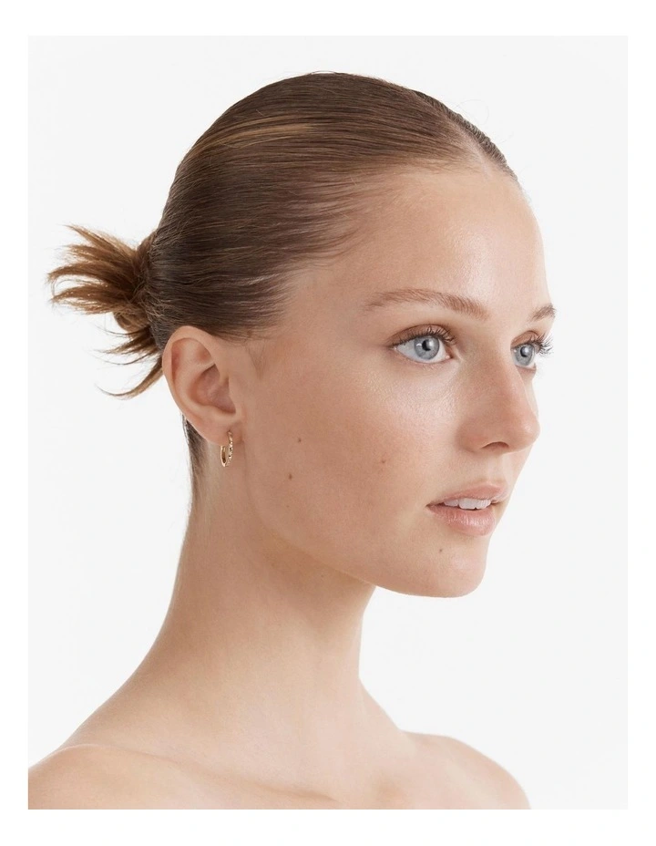 Vela Large Huggie Hoop Earrings in Gold image 2