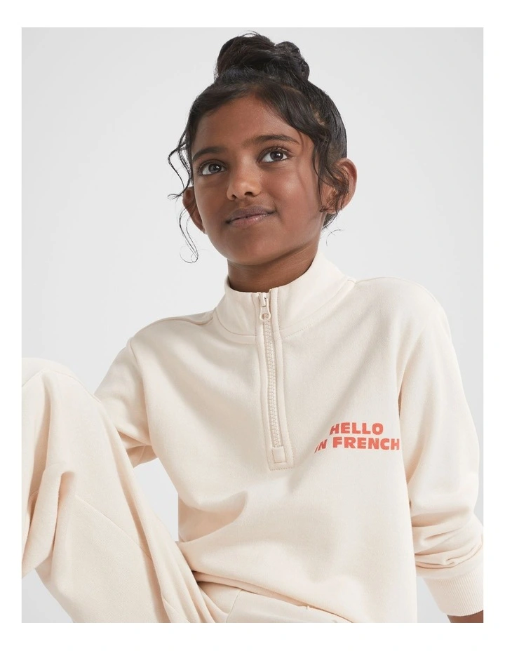 Zip Slogan Sweat Top in Creme image 1