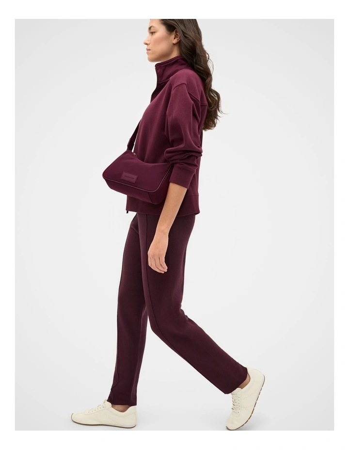 Tech Essential Crossbody Bag in Plum Red image 2