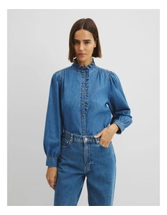 Denim Long Sleeve Ruffle Sh in Mid Blue Wash