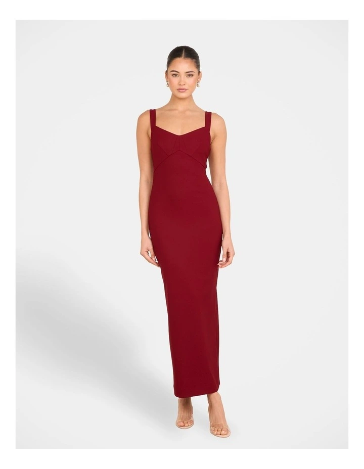 rihanna burgundy dress The normally risque Rihanna looks demure in a sophisticated maroon dress at Zac Posen fashion show