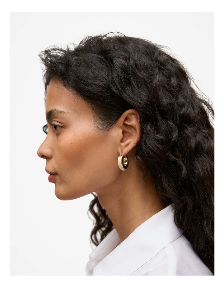 Lutra Huggie Earrings in Tahini image 2