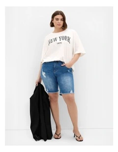 Distressed Longline Denim Shorts in Mid Wash