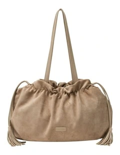 DRAWSTRING TASSLE SHOULDER BAG IN SAND FAUX SUEDE