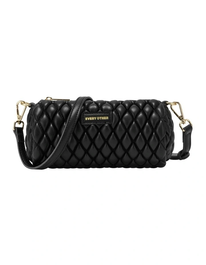 QUILTED BARREL BAG IN BLACK image 1